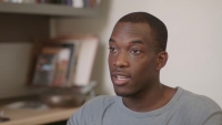A male patient talking in an office
